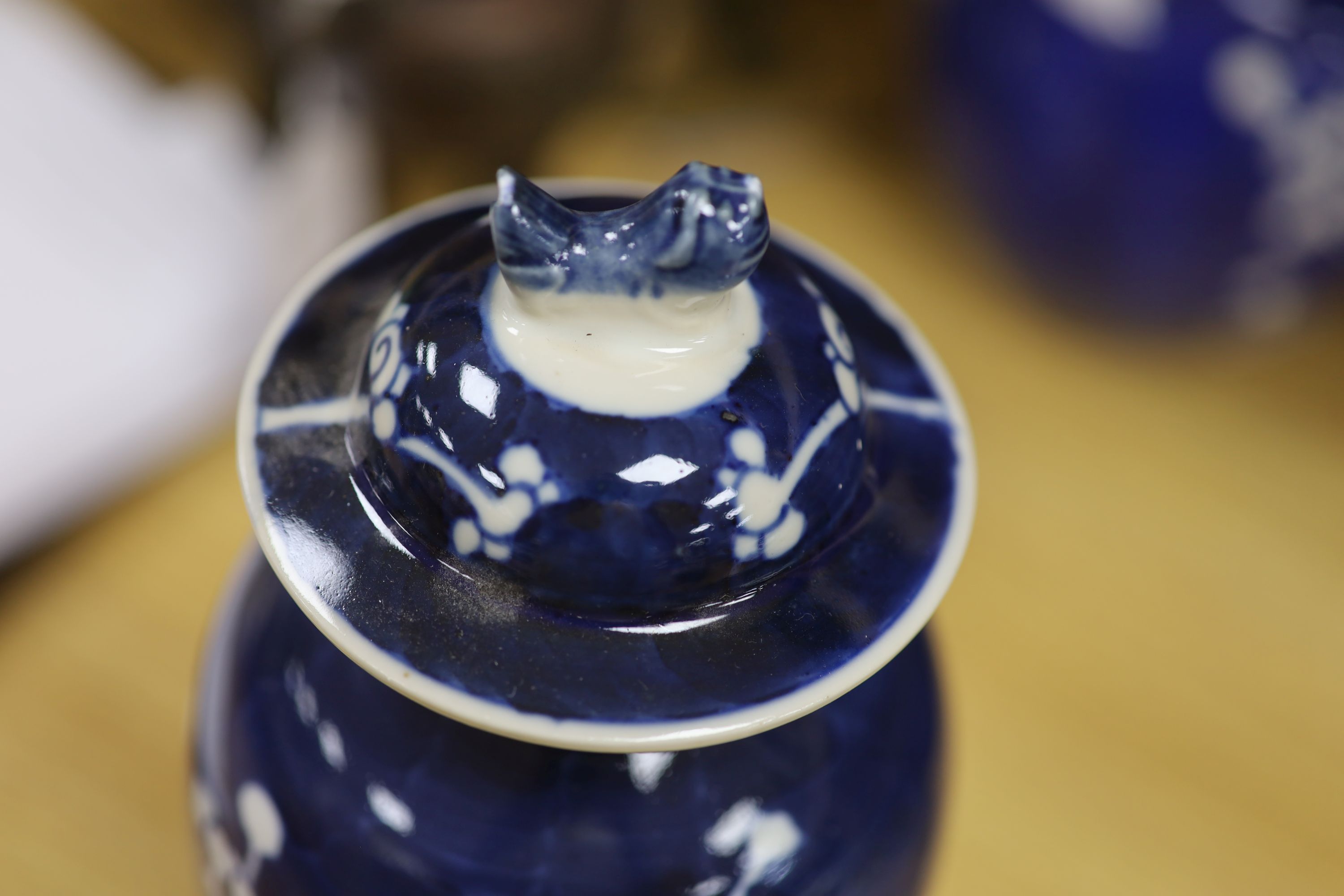 A Chinese blue and white cylindrical vase, another vase and cover and a blue and white jar and cover, together with a cloisonne vase and a bronze censer, tallest 32cm